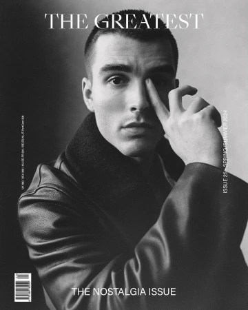 Monochrome portrait of a young man wearing a dark leather jacket with hand near his face for The Greatest magazine cover by Charlotte Hadden