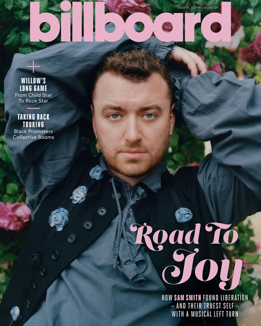 Billboard magazine cover featuring Sam Smith wearing a vest with floral embellishments, styled with a frilly shirt and floral background.