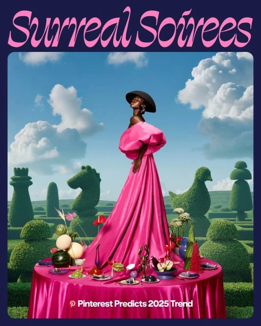 Black woman in a pink gown stands at a table with assorted dishes and drinks, in an outdoor garden with topiary art and blue skies.
