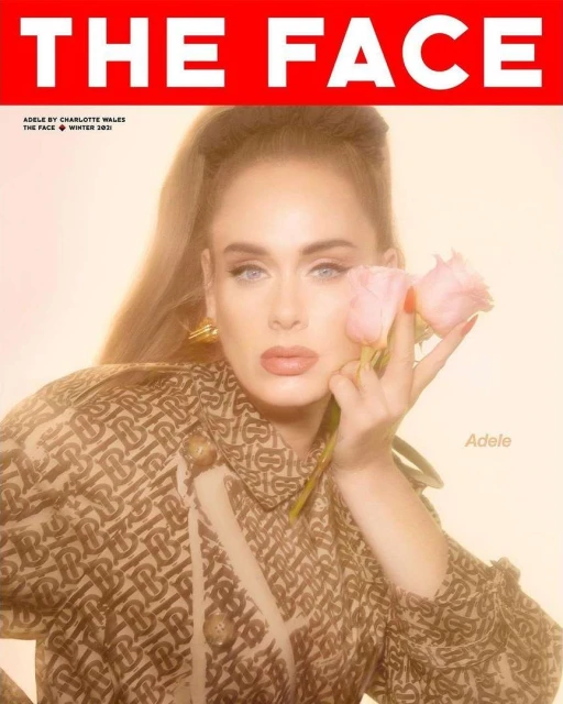 Magazine cover featuring a light-skinned adult female holding flowers and wearing a patterned jacket, with 'THE FACE' in bold red letters.