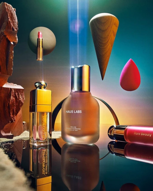 Several beauty products, including Haus Labs and Rare Beauty brands, are displayed with geometric shapes and a gradient background.