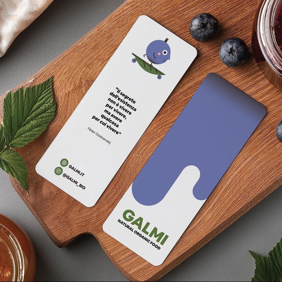 Close-up of two product cards for Galmi Natural Organic Food featuring a cartoon blueberry, alongside blueberries and jam.