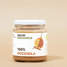 Glass jar of hazelnut spread with white lid and illustrated label featuring a character swinging.