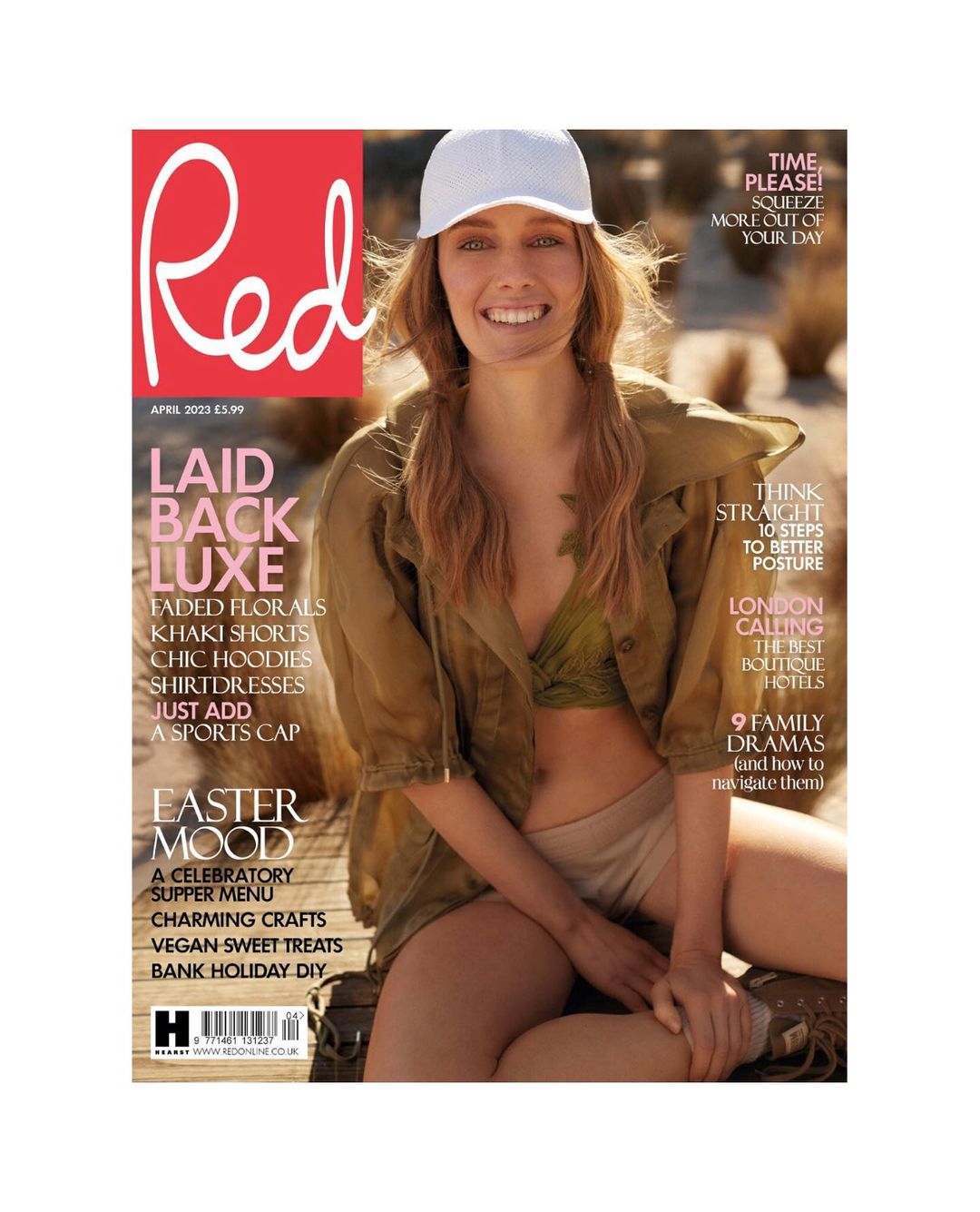 Magazine cover featuring a smiling woman in a cap and casual attire, with the magazine title 'Red' prominently displayed in red.