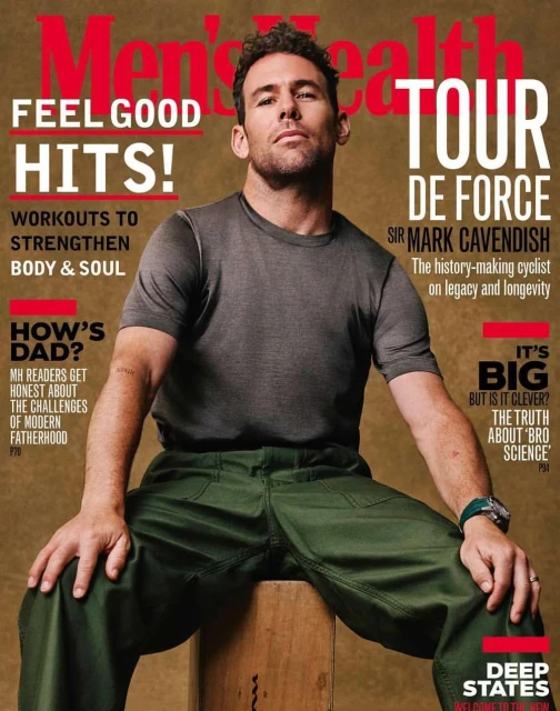 Men's Health magazine cover featuring a man in gray t-shirt and green pants sitting on a wooden box against a tan background.