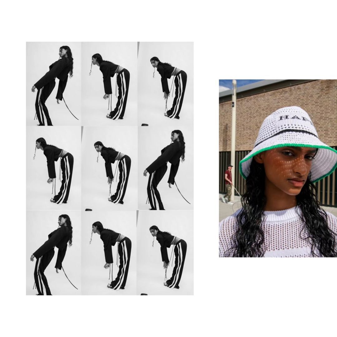 Woman in bucket hat poses outdoors in natural light. Fashion shoot of model wearing knit bucket hat, black crop top and striped pants.