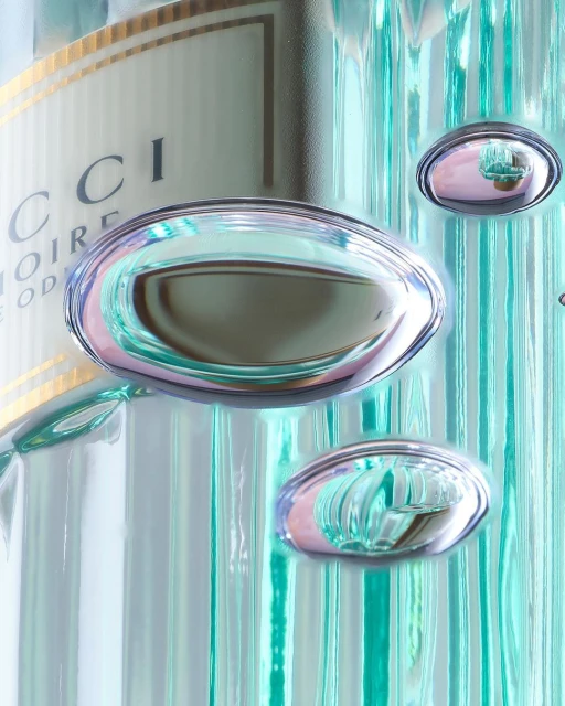 Close-up of a glass Gucci perfume bottle with water droplets and reflective surfaces creating a visually interesting and elegant composition.