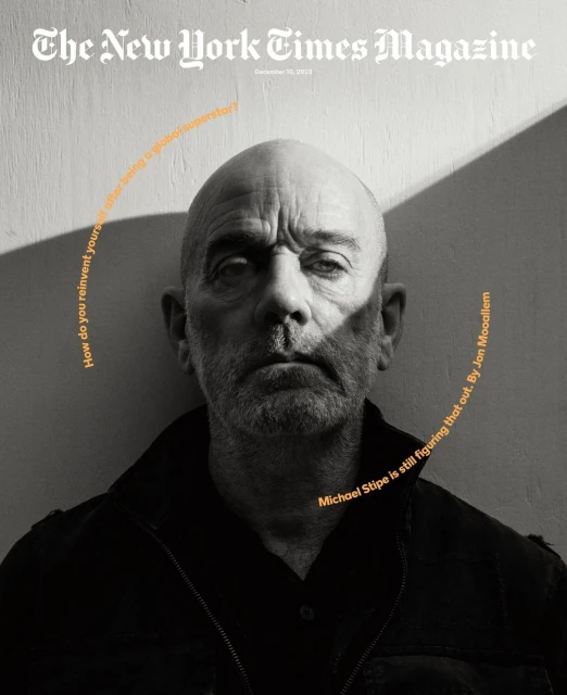 The New York Times Magazine cover featuring a portrait of Michael Stipe in a black-and-white photo with shadow play on the textured wall background.