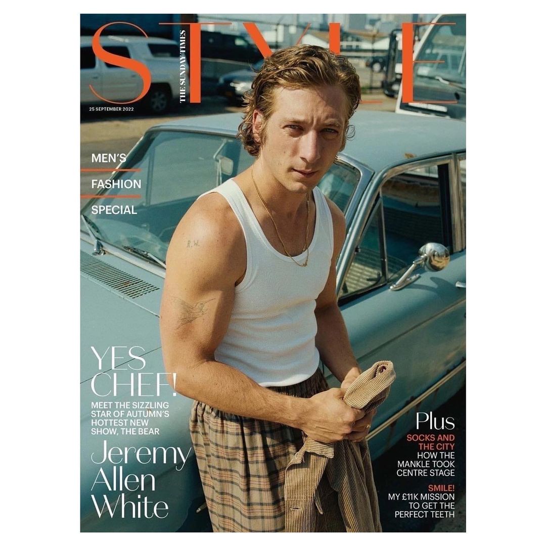 Sunday Times Style magazine cover featuring Jeremy Allen White leaning on a light blue car in plaid pajama pants and a white tank top.