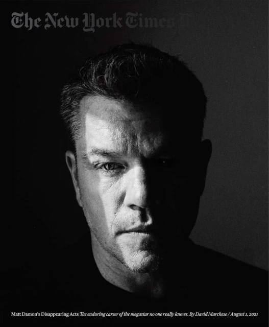 Black and white portrait of Matt Damon for The New York Times, face shadowed, magazine masthead visible, serious expression.