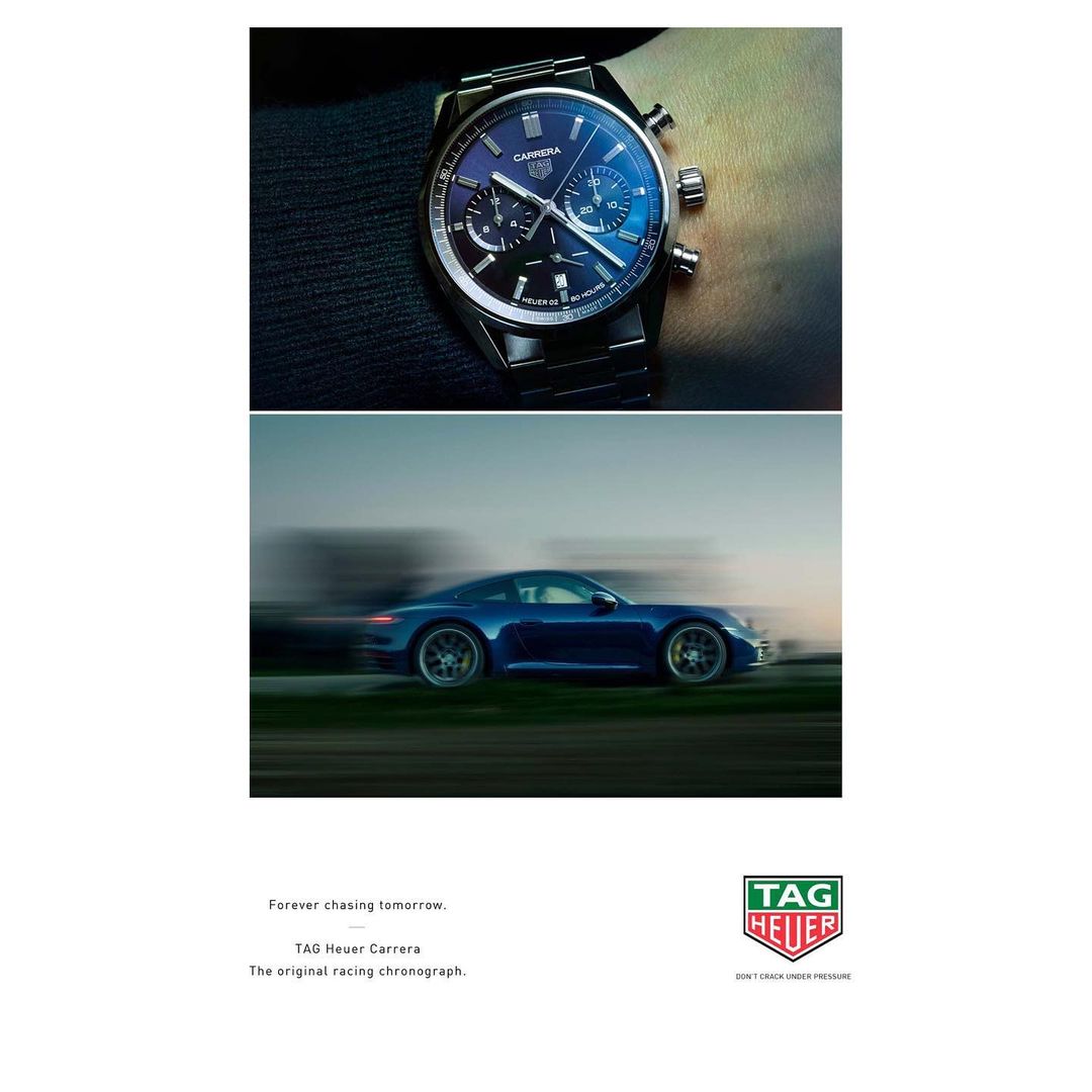 Wristwatch on a male wrist above a blurred image of a speeding blue sports car for a luxury brand advertisement.