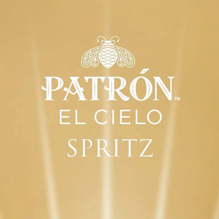 Promotional image for Patron El Cielo Spritz, featuring the brand's logo and product name against a blurred golden background.