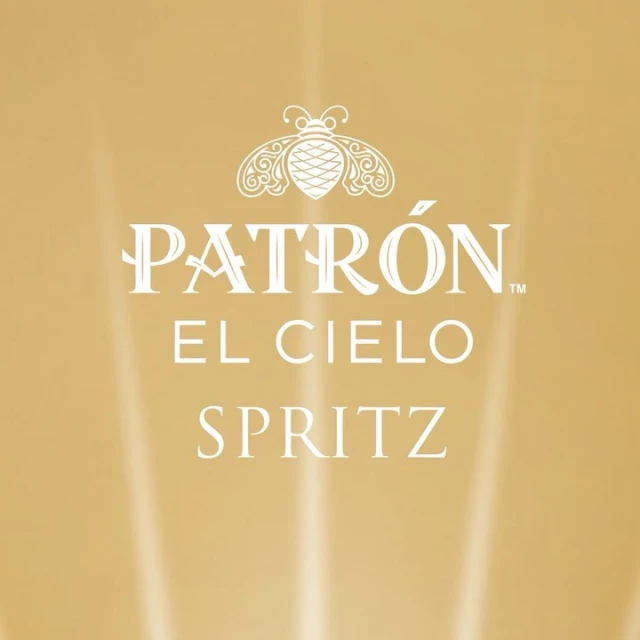 Promotional image for Patron El Cielo Spritz, featuring the brand's logo and product name against a blurred golden background.