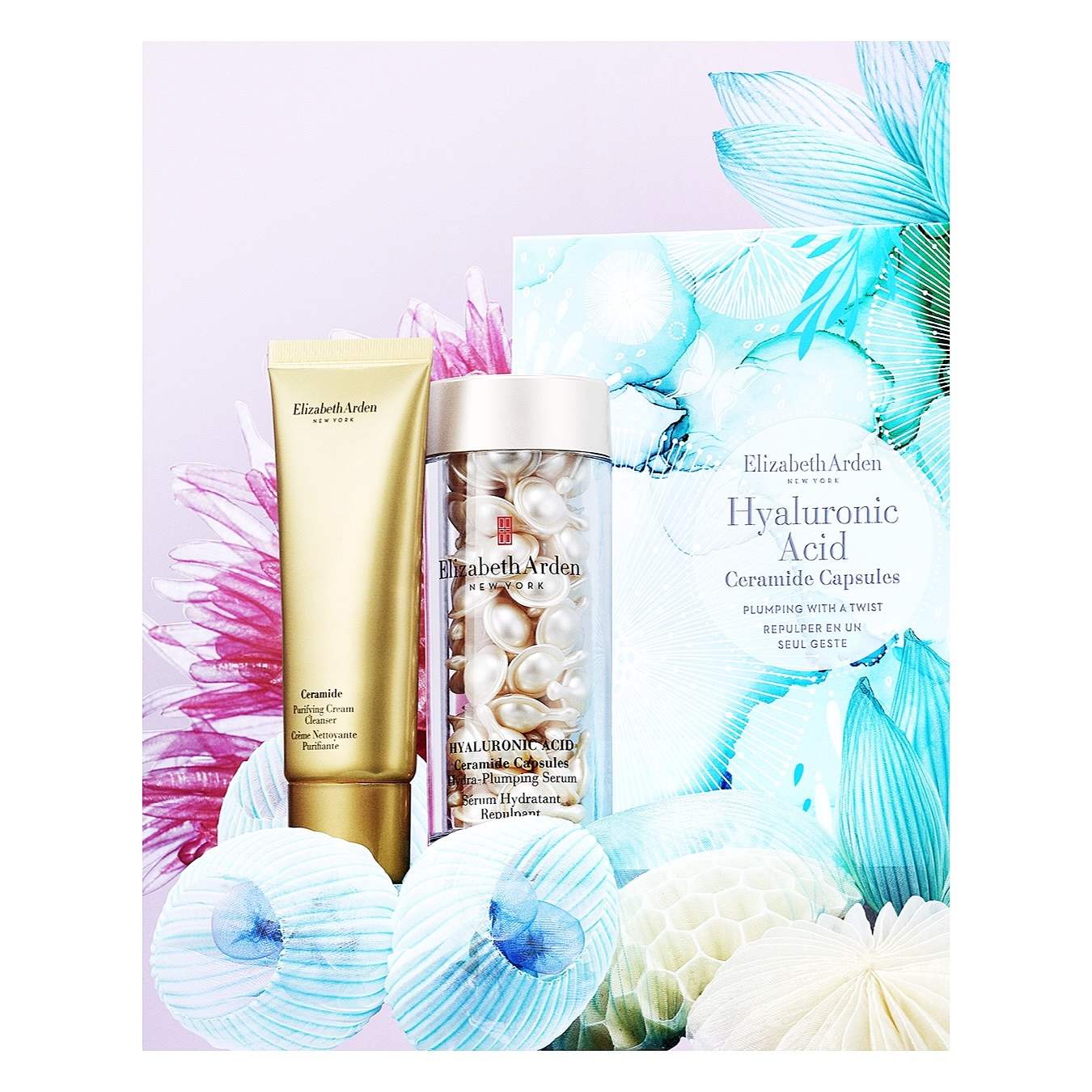 Close-up of Elizabeth Arden skincare products: Ceramide Retinol Cream, Hyaluronic Acid Ceramide Capsules, against floral background.