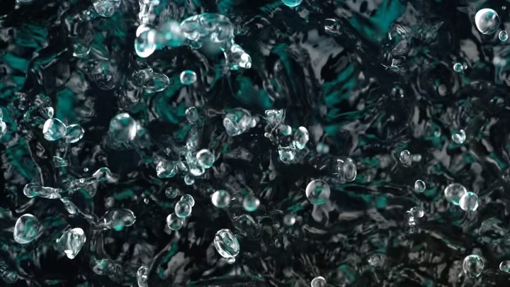 Water droplets suspended mid-air create dynamic abstract art with dark teal and black background. The surface ripples as the droplets fall.