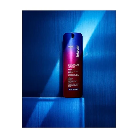 StriVectin advanced retinol bottle in a studio environment, featuring blue background.