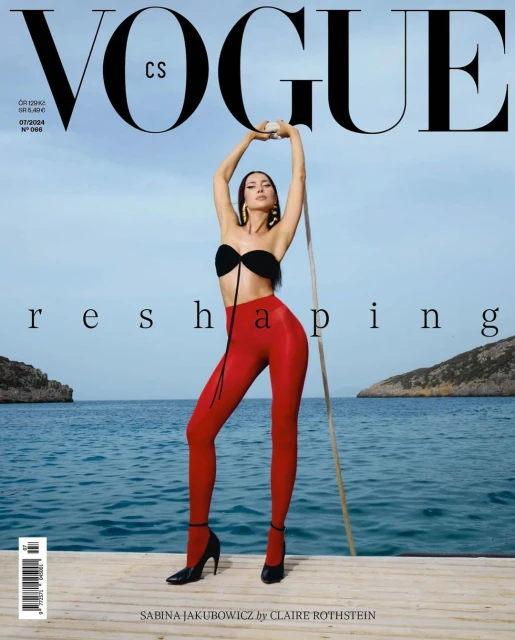 Vogue magazine cover featuring Sabina Jakubowicz in a black bikini top and red leggings, posing outdoors with blue sea background.