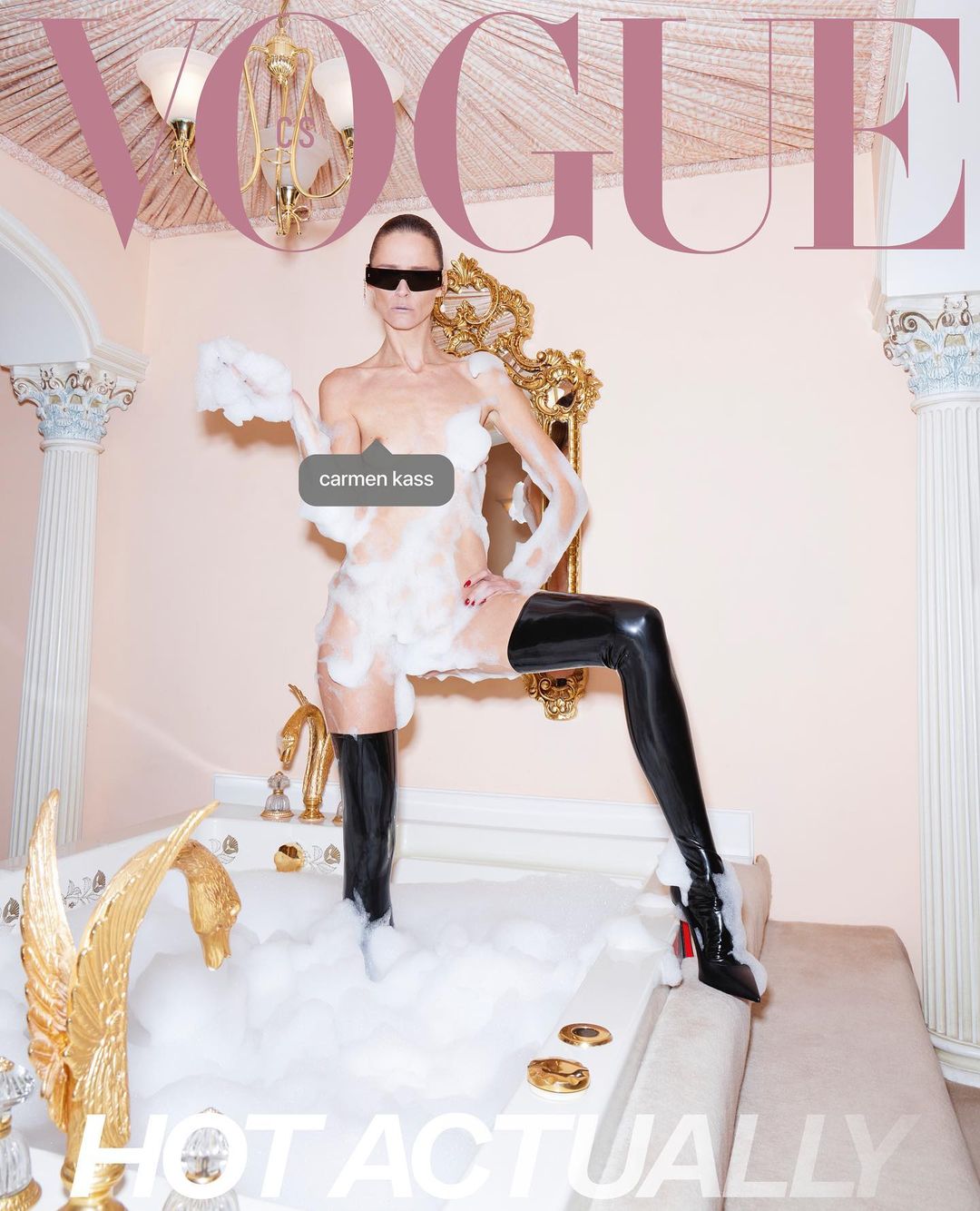 Vogue cover featuring a model in a bathtub filled with bubbles, wearing black thigh-high boots and sunglasses in an indoor setting.