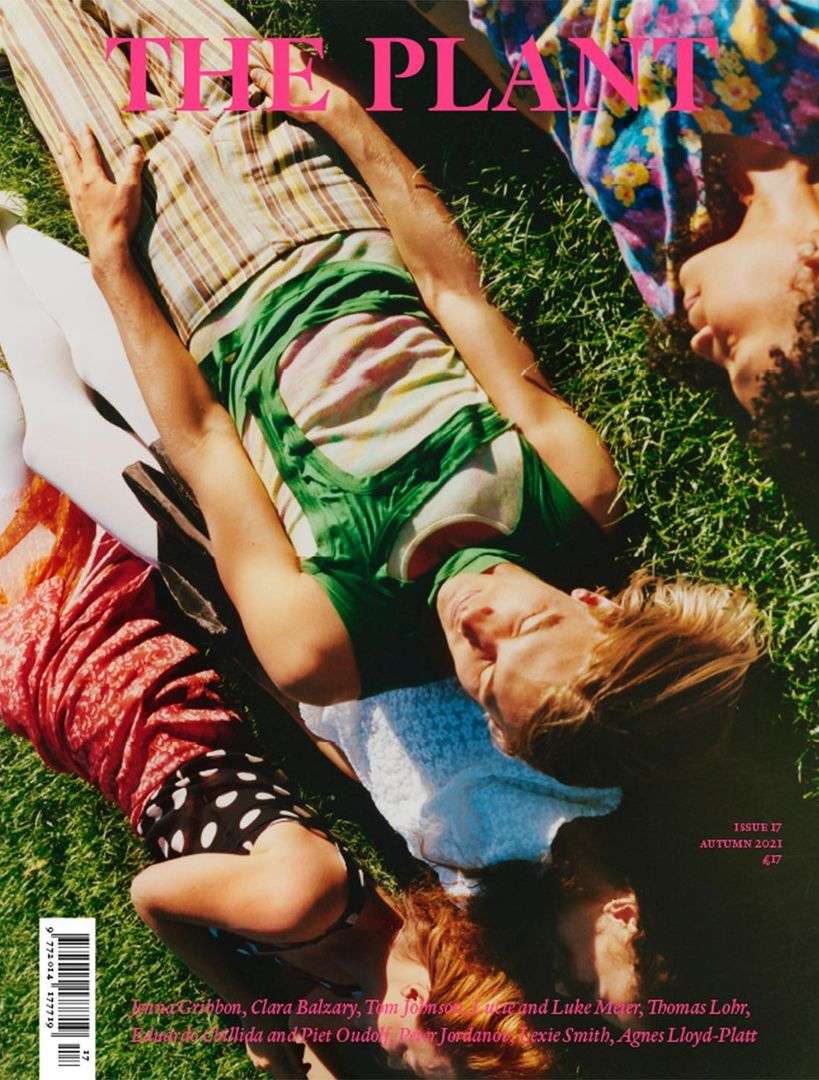 Magazine cover featuring four people lying on grass. Text reads, “The Plant,” and issue information. Shot outdoors in natural light.