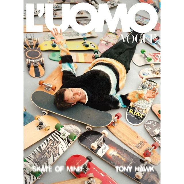 Magazine cover featuring Tony Hawk lying on a skateboard surrounded by other skateboards. The magazine is L'Uomo Vogue May 2021.