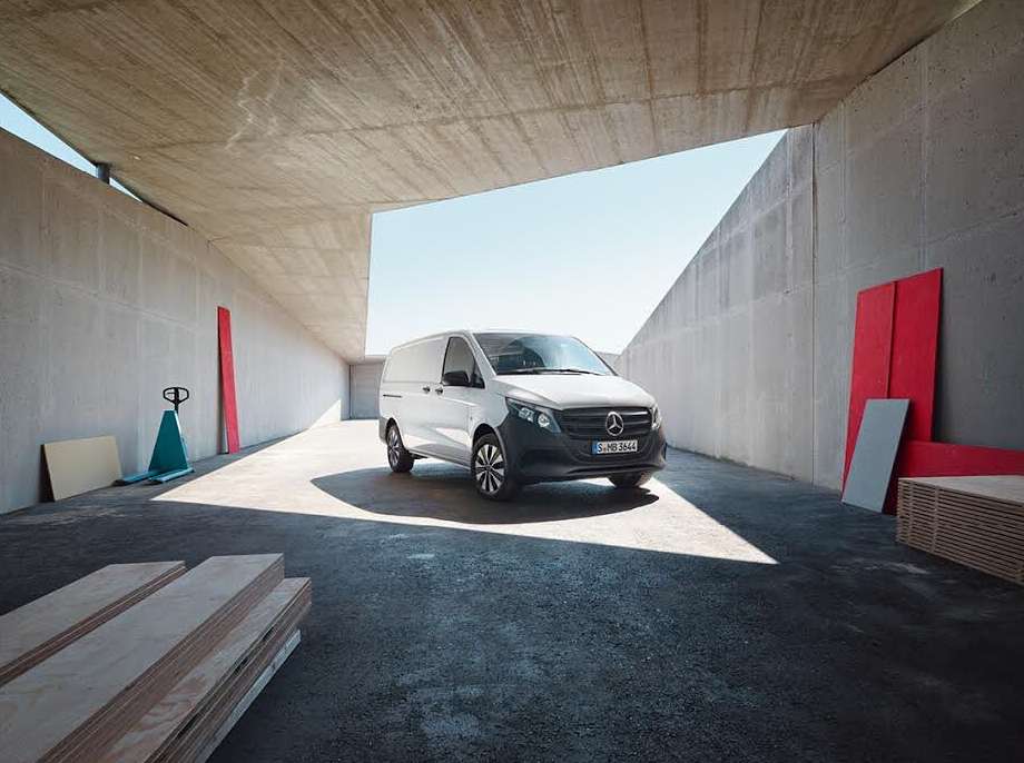 Mercedes-Benz van parked in an industrial loading area on a sunny day, promoting automotive transport and commercial vehicle solutions.