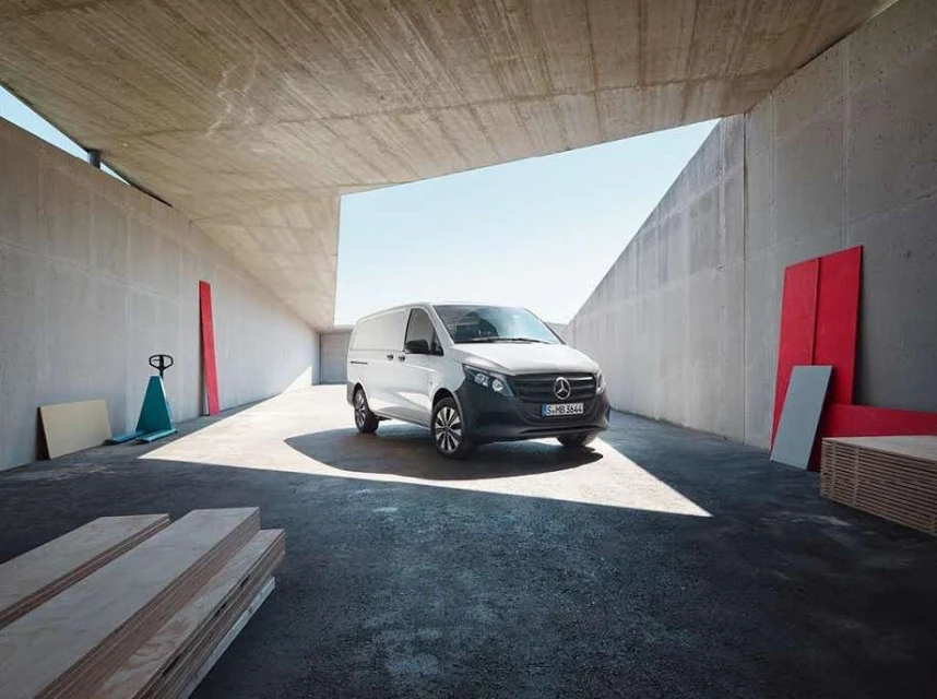 Mercedes-Benz van parked in an industrial loading area on a sunny day, promoting automotive transport and commercial vehicle solutions.