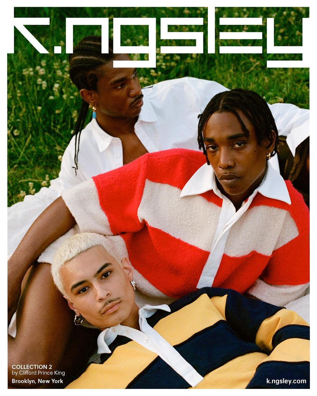 Three young adults model Kingsley Collection 2 knitwear, posing on a lawn with white flowers, showcasing fashion and natural light.