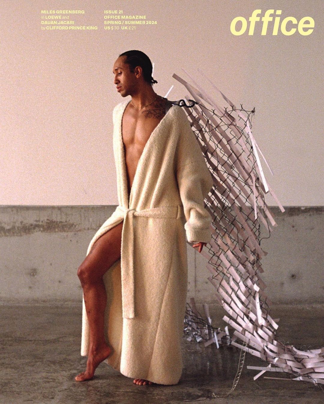 Magazine cover featuring a bare-chested man in a bathrobe and shredded paper wings, with 'office' magazine text. Fashion editorial.
