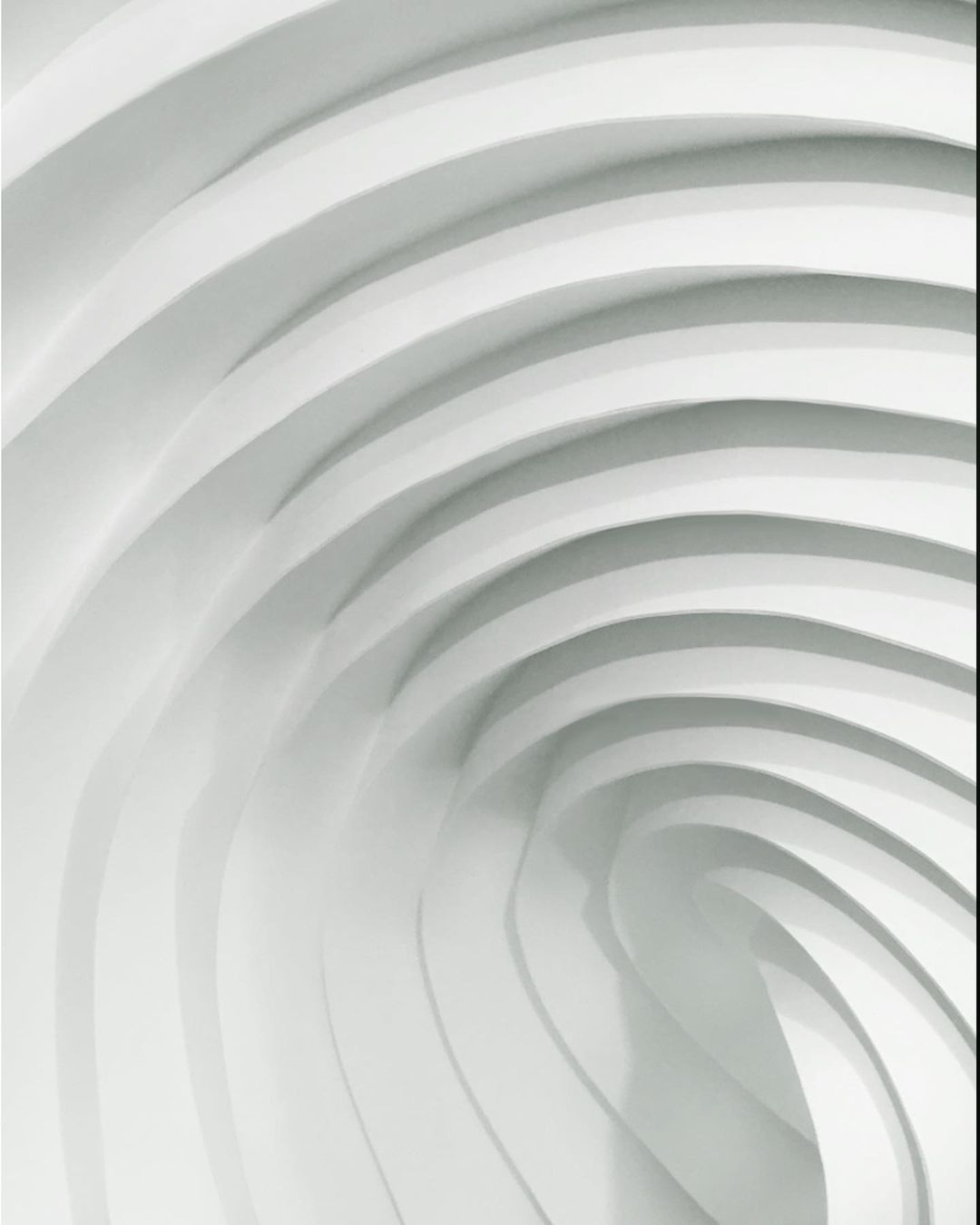Abstract white architecture with curved parallel lines creating a modern design aesthetic, minimalist and clean composition.
