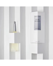 Issey Miyake L'Eau d'Issey perfume bottle and box positioned within geometric white architectural niches.
