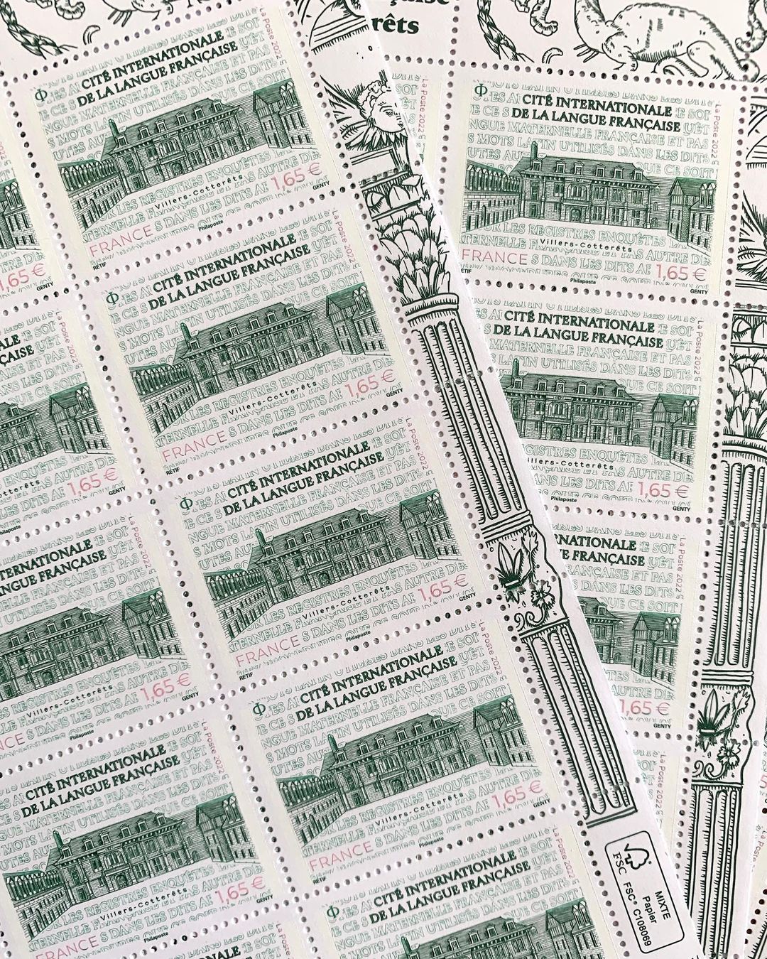 Collection of French postage stamps featuring building and text 'Cité Internationale de la Langue Française', arranged in a dense pattern.