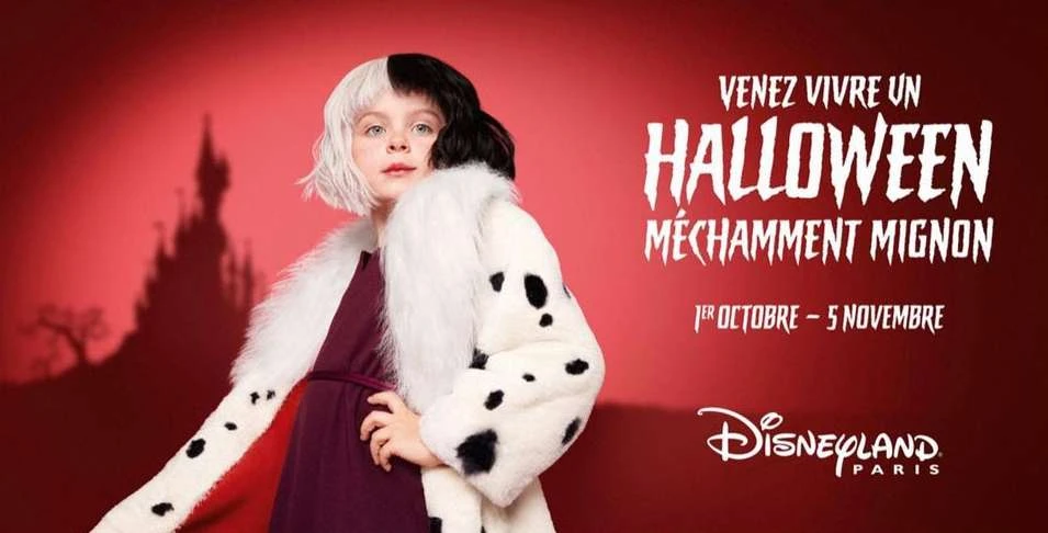 Young girl dressed in Cruella de Vil costume with a Dalmatian-print coat against a red backdrop for a Disneyland Paris Halloween event.