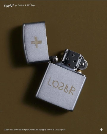 Silver Zippo-style lighter with an open lid, etched with a plus sign and the word LOSER, set against an olive-green background.