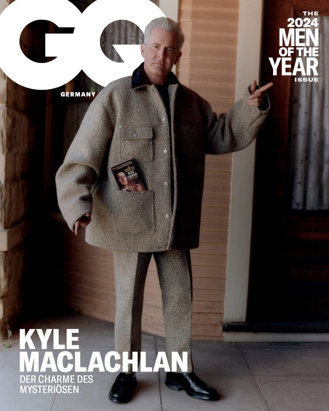 GQ Magazine cover featuring Kyle MacLachlan in a tweed suit, shot outdoors in front of a rustic building with visible magazine text.