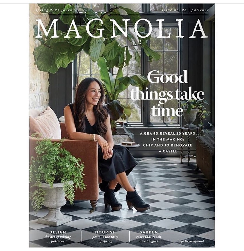 Magazine cover features Joanna Gaines seated indoors with plants, promoting 'Magnolia' spring journal issue, showcasing home and garden themes.