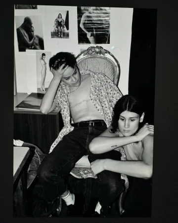 Black and white portrait of two young people indoors by photographer Collier Schorr