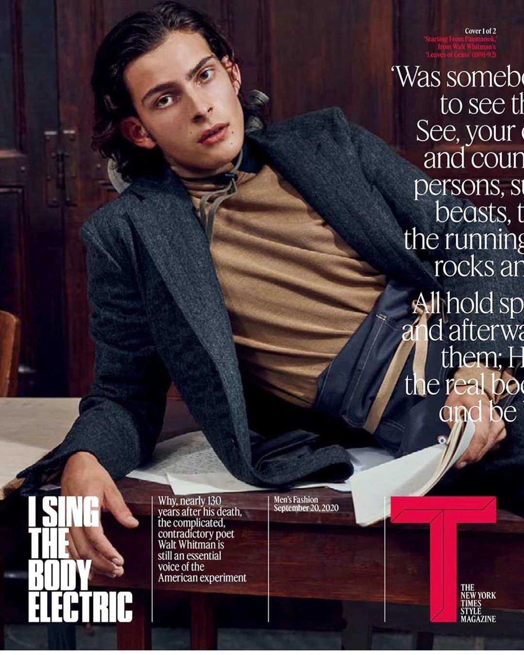 Magazine cover featuring a young man in a blazer and turtleneck, reclining on a table with a book. The New York Times Style Magazine.