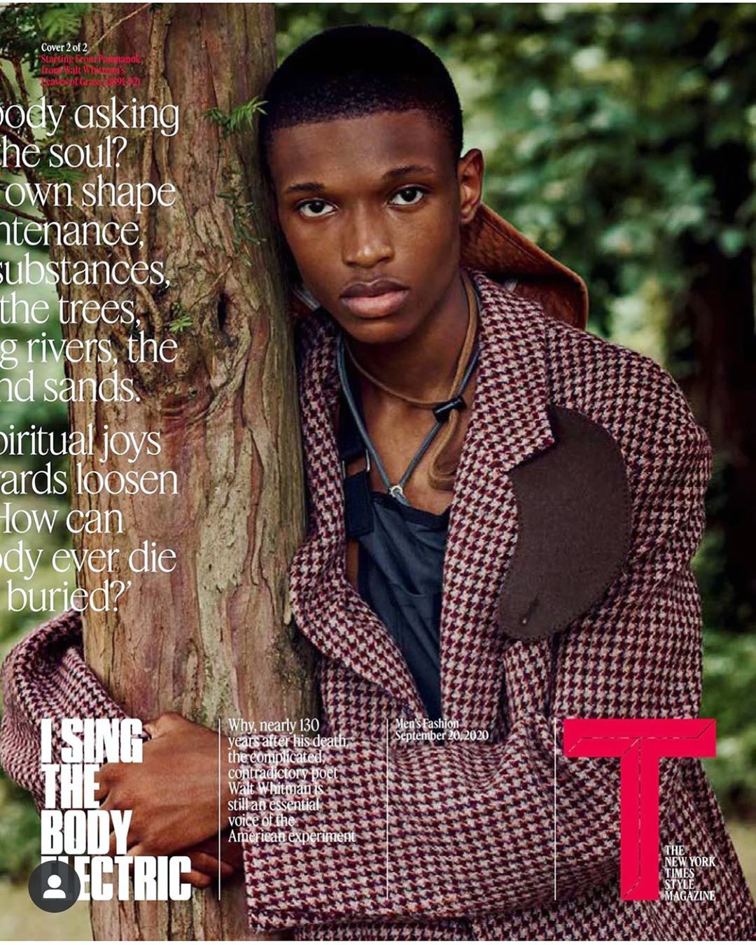 Close-up of an adult male model leaning against a tree, wearing a patterned coat in a wooded setting with a magazine cover graphic overlay.