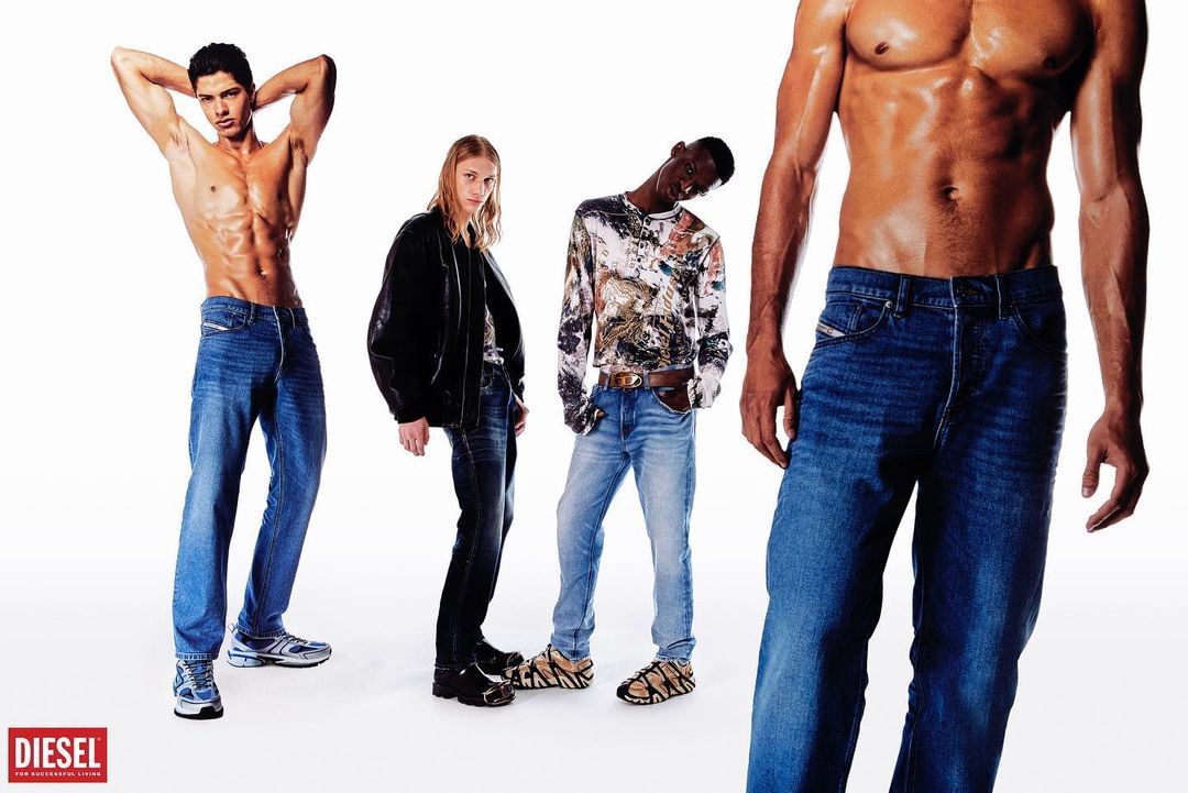 Four athletic male models pose shirtless wearing dark-wash jeans in a bright studio. A Diesel brand logo is visible in the corner.
