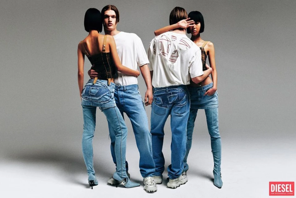 Two women and two men wearing denim and casual tops are posing in a photo studio with a gray background, fashion studio shot.