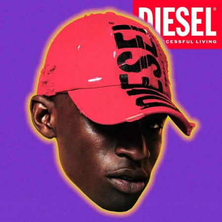 African-American man with close-cut hair wears red baseball cap with a black logo against a purple background with a brand logo.
