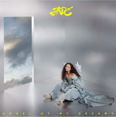Young woman with angel wings sits gracefully in an ethereal setting, complemented by a window view of cloudy skies, in a light and airy scene.