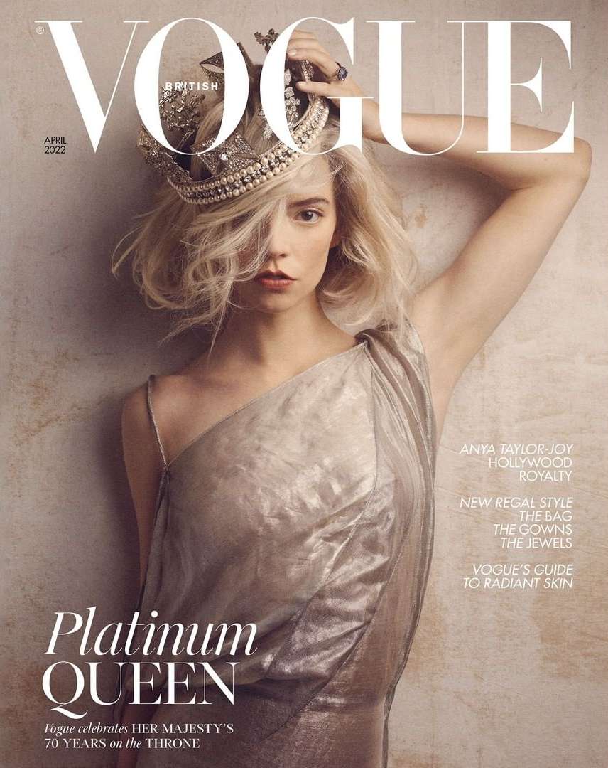 Vogue British magazine cover featuring Anya Taylor-Joy wearing a crown and a metallic dress, photographed in a studio with a beige backdrop.