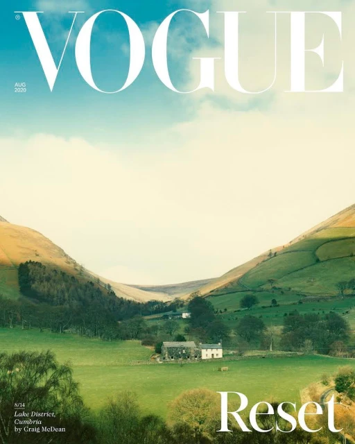 Vogue cover featuring a landscape view of Lake District, Cumbria with rolling hills, fields, and a clear sky.
