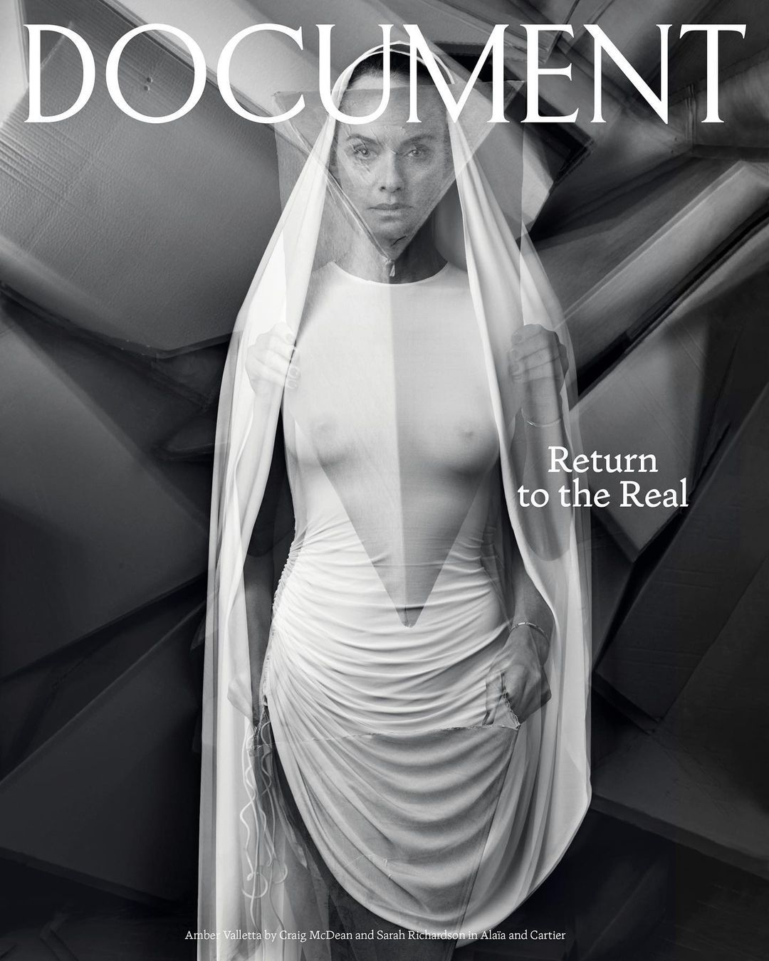 Magazine cover featuring a woman in a white dress with sheer fabric, posing against an abstract geometric background in black and white.