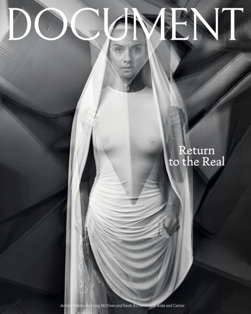 Magazine cover featuring a woman in a white dress with sheer fabric, posing against an abstract geometric background in black and white.