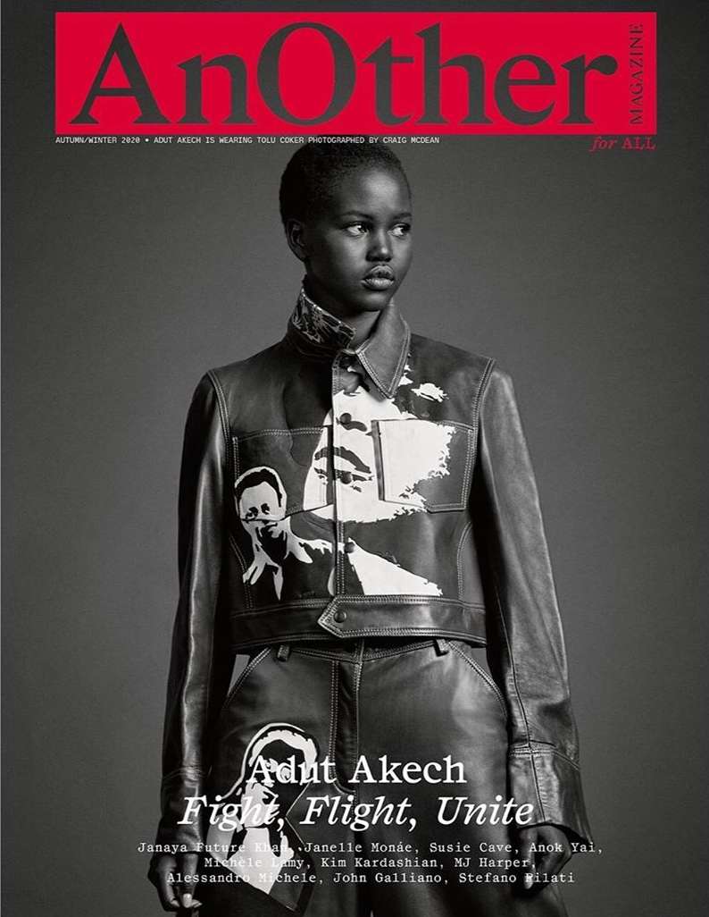 Magazine cover featuring Adut Akech in a leather jacket and pants with black and white graphics, set against a gray backdrop.