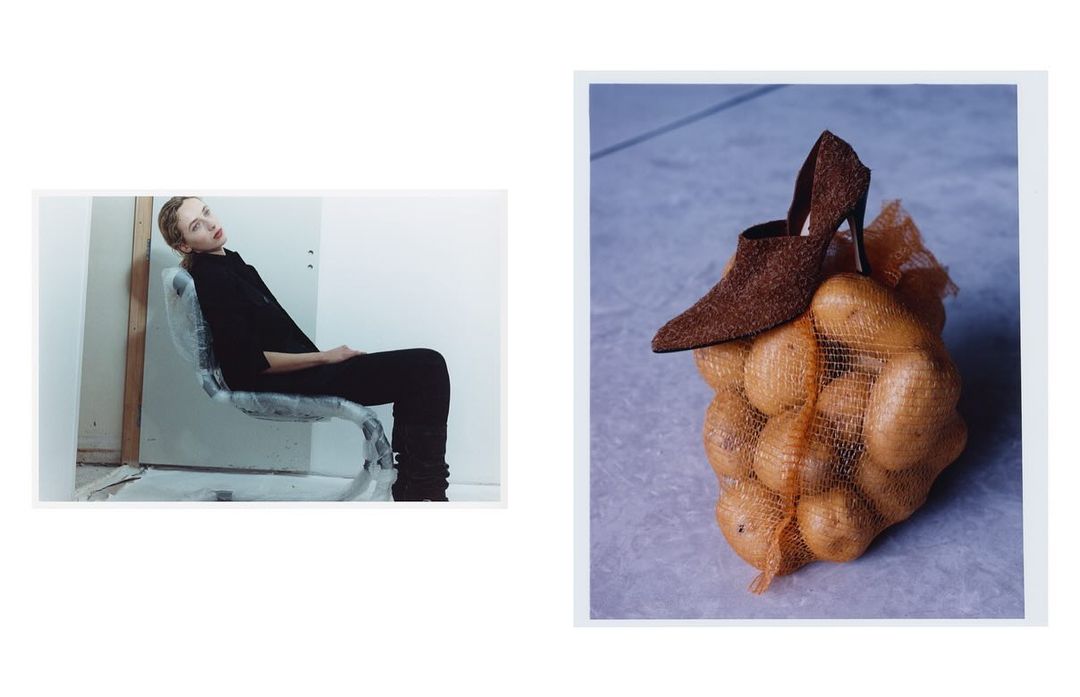 Fashion photo: a woman in black sits on a wrapped chair against a white wall, opposite a shoe perched on a bag of potatoes.