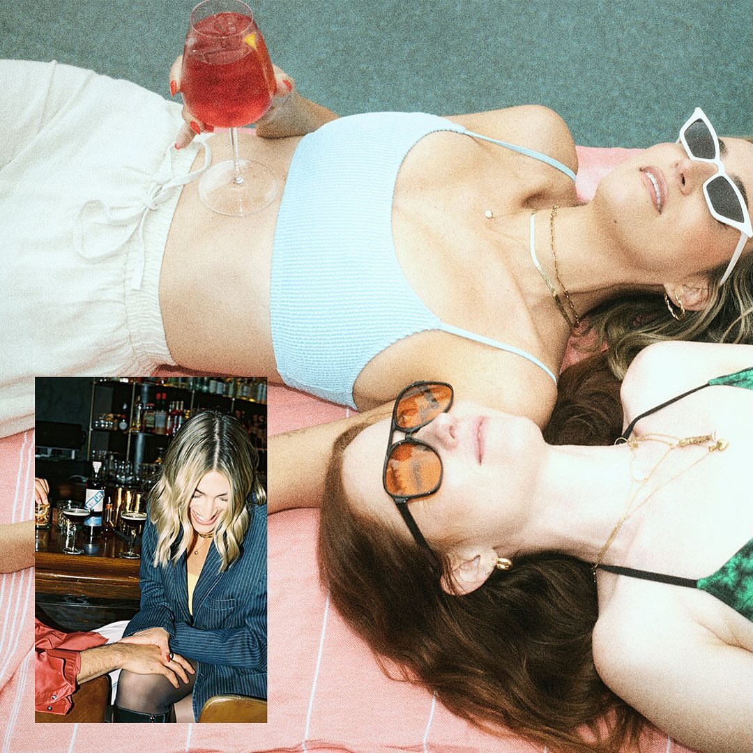 Two women lounge on a pink striped surface in swimwear and sunglasses, one holding a cocktail; an inset image shows another woman at a bar.
