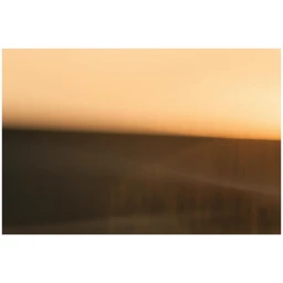Abstract photography with horizontal bands of warm orange and dark brown tones by Cyrille De Vignemont